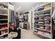 This large walk-in closet features shelving and storage space for clothing at 13602 Huntson Park Ln, Huntersville, NC 28078