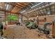 Spacious barn interior with multiple storage areas, equipment and good lighting at 140 Hearthstone Dr, Statesville, NC 28677