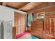 Bedroom with wooden walls and cabinetry, complemented by colorful accents and carpeting at 140 Hearthstone Dr, Statesville, NC 28677