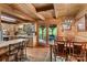 Cozy kitchen with dining area that features wooden cabinets, a breakfast bar, and a deck entrance at 140 Hearthstone Dr, Statesville, NC 28677
