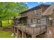 Charming log home with a large deck, perfect for enjoying the natural surroundings at 140 Hearthstone Dr, Statesville, NC 28677