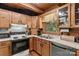 Charming kitchen boasting light-colored wooden cabinets and stainless-steel dishwasher at 140 Hearthstone Dr, Statesville, NC 28677