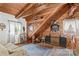Cozy living space with wood ceilings and beams, furnished with vintage furniture at 140 Hearthstone Dr, Statesville, NC 28677