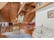 Lofted living area featuring wood floors and ceilings, along with a comfortable couch at 140 Hearthstone Dr, Statesville, NC 28677