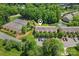 Aerial view of community with pond, tennis court, landscaping, and ample parking at 14118 Yachtsman Harbor Dr, Charlotte, NC 28278