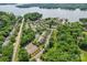 Breathtaking aerial view of community with lake, tennis courts, pool, clubhouse and green landscaping at 14118 Yachtsman Harbor Dr, Charlotte, NC 28278