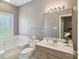 Bathroom with bathtub, neutral vanity, mirror and toilet at 14118 Yachtsman Harbor Dr, Charlotte, NC 28278