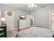Well-lit bedroom with TV, closet storage, ceiling fan, and access to the bathroom at 14118 Yachtsman Harbor Dr, Charlotte, NC 28278