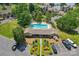 Aerial view showcasing the community pool, clubhouse, and well-manicured landscaping; ideal for relaxation and recreation at 14118 Yachtsman Harbor Dr, Charlotte, NC 28278