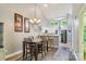 Dining room featuring hardwood floors and easy access to an open style kitchen and living space at 14118 Yachtsman Harbor Dr, Charlotte, NC 28278