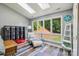Bright sunroom with seating, hardwood floors, skylights and a view to the backyard at 14118 Yachtsman Harbor Dr, Charlotte, NC 28278