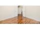 Bedroom featuring hardwood floors and open double doors leading to other rooms at 1465 Porters Ct, Concord, NC 28025