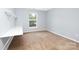 Bedroom with neutral carpet, white trim, a built-in desk, and a bright window at 1465 Porters Ct, Concord, NC 28025