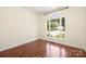 Bedroom with hardwood flooring and a bright arched window overlooking the yard at 1465 Porters Ct, Concord, NC 28025