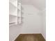Walk-in closet with shelves and hanging rods for optimal organization and storage at 1465 Porters Ct, Concord, NC 28025