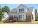 Back exterior view of home featuring a deck, bay window and well-kept lawn at 1465 Porters Ct, Concord, NC 28025