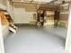 Spacious garage featuring epoxy flooring, shelving, and ample storage solutions for organization at 1465 Porters Ct, Concord, NC 28025