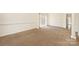 Bright living room with neutral carpet, white trim, and a large window at 1465 Porters Ct, Concord, NC 28025
