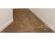 Carpeted stairs with white trim at 1465 Porters Ct, Concord, NC 28025