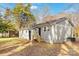 Charming single-story home featuring a spacious backyard shaded by mature trees, with easy access via wooden stairs at 1637 Sumner Dr, Rock Hill, SC 29732