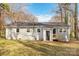 Charming one-story home with a neatly maintained backyard and wooden stairs leading to a rear entrance at 1637 Sumner Dr, Rock Hill, SC 29732