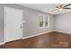 Bright bedroom featuring gray walls, hard wood floors, and a classic ceiling fan at 1637 Sumner Dr, Rock Hill, SC 29732