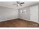 Bright bedroom boasts wood-look floors, neutral paint, and a ceiling fan at 1637 Sumner Dr, Rock Hill, SC 29732