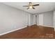 The gray painted bedroom features wood-look floors and ample space at 1637 Sumner Dr, Rock Hill, SC 29732
