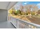 Relaxing porch view showcasing the railing, large yard, and neighborhood at 1637 Sumner Dr, Rock Hill, SC 29732