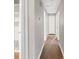 Bright hallway with dark wood-look floors and white trim at 1637 Sumner Dr, Rock Hill, SC 29732