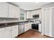 This well-lit kitchen has stainless steel appliances and white cabinets at 1637 Sumner Dr, Rock Hill, SC 29732