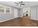 Living room with wood-look floors flows into the white kitchen at 1637 Sumner Dr, Rock Hill, SC 29732