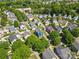 Charming neighborhood featuring colorful single-Gathering homes, mature trees, and well-maintained lawns at 1821 Ethel Guest Ln, Charlotte, NC 28206