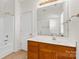 Well-lit bathroom featuring a vanity with a dark wood base and a shower/tub combination at 1821 Ethel Guest Ln, Charlotte, NC 28206