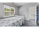Well-lit bedroom with neutral decor and a view of the outdoors at 1821 Ethel Guest Ln, Charlotte, NC 28206