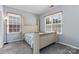 Bright bedroom featuring a large window and neutral-toned walls at 1821 Ethel Guest Ln, Charlotte, NC 28206