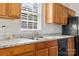 Well-lit kitchen featuring a stainless steel sink and modern appliances at 1821 Ethel Guest Ln, Charlotte, NC 28206