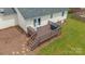 An inviting back deck features new decking, a grill, and outdoor living space at 195 Antler Dr, Statesville, NC 28625