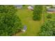 A large backyard featuring a storage shed, fire pit area, and a well-maintained lawn perfect for outdoor activities at 195 Antler Dr, Statesville, NC 28625