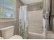 Bathroom featuring a toilet, window, bathtub with shower and decorative shower curtain at 195 Antler Dr, Statesville, NC 28625
