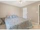 Bedroom featuring a large bed with decorative blanket, window, and beige carpet at 195 Antler Dr, Statesville, NC 28625