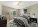 Inviting bedroom features a large bed, neutral walls, large window, and dark wood furniture at 195 Antler Dr, Statesville, NC 28625
