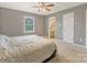 Bedroom view featuring a double bed with grey walls, a large window, and ensuite bathroom at 195 Antler Dr, Statesville, NC 28625