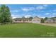 Charming single-story home boasts a manicured lawn and an attached two-car garage at 195 Antler Dr, Statesville, NC 28625