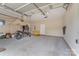 Spacious garage featuring concrete flooring, ample storage, and a motorcycle at 195 Antler Dr, Statesville, NC 28625