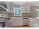 Stainless steel appliances shine in this cozy kitchen with bright countertops at 195 Antler Dr, Statesville, NC 28625