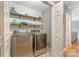 Convenient laundry room with open shelving, modern washer and dryer, and easy access at 195 Antler Dr, Statesville, NC 28625