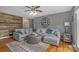Inviting living room features hardwood floors, a ceiling fan, and ample natural light at 195 Antler Dr, Statesville, NC 28625