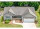 Aerial view of a single-story home with a well-maintained roof and landscaped yard at 206 Pine Meadow St, Hickory, NC 28601