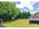 Enjoy this backyard with a deck, lush greenery, and an abundance of space for outdoor activities and relaxation at 206 Pine Meadow St, Hickory, NC 28601
